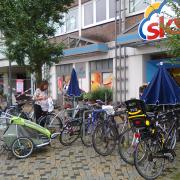 Cycle parking outside a small supermarket