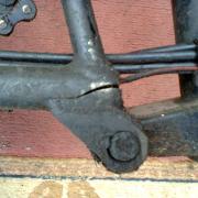 Cracked vintage Brompton rear triangle
