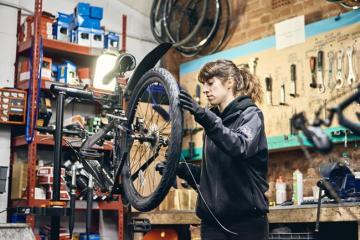 Marta working on a bike