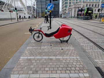 Red Baron Lands on Traffic Island Red Baron Recumbent Cycle in Centenary Square